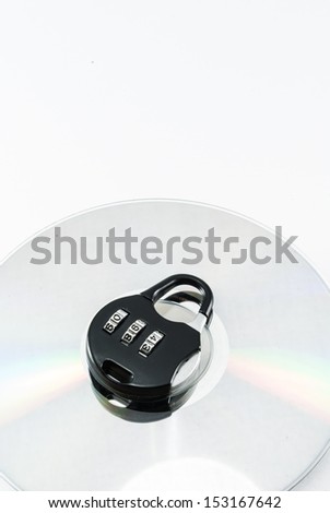 compact disk with a security lock on it conceptual isolated image