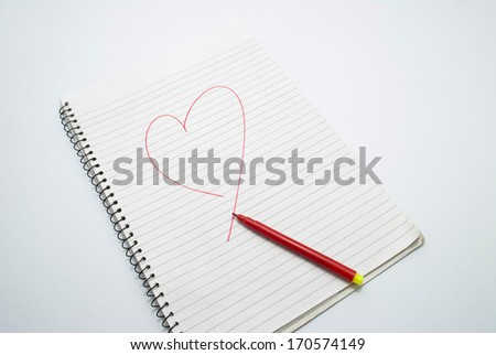 book with red sketch and a heart drawn on an isolated background