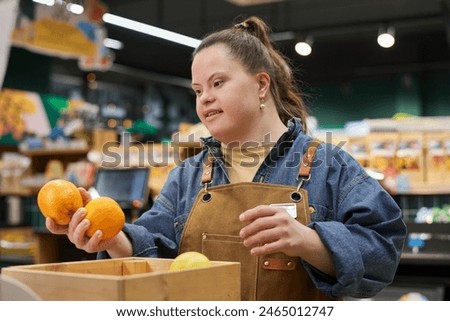 Image, Stock Photo Disabled young woman in kitchen with cat on her lap