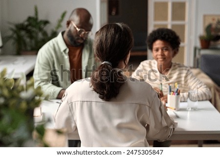 Similar – Image, Stock Photo Black woman talking on smartphone near sea in sunset
