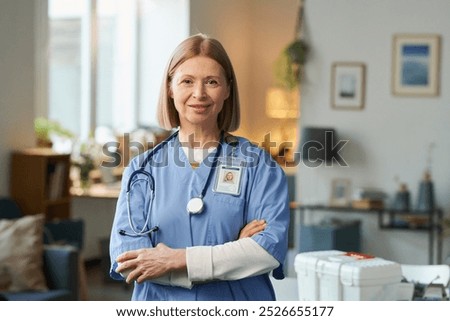 Similar – Image, Stock Photo Female doctor looking out the hospital window