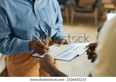 Similar – Image, Stock Photo Plumber signs a contract for the services in the kitchen