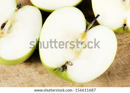 Slices of  green apple with  on white background