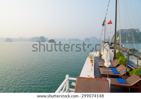 Beautiful view from sundeck of tourist junks in Ha Long bay. Ha Long bay (Vietnam) is the World\'s Natural Heritage and very famous for its natural beauty of thousands of islands.
