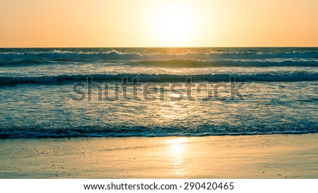 Ocean and beach at sunset. California Coast. Abstract seascape background. Original film shot.