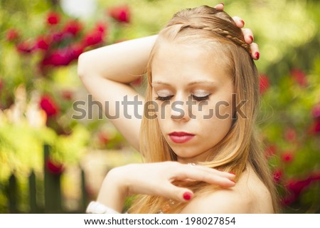 beautiful girl model on the bright pictures. In the background is blurred roses