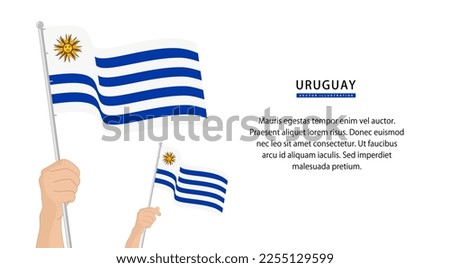Hand holding Uruguay flag. Illustration in flat style. Waving flag of Uruguay isolated. vector illustration