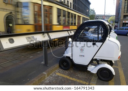 MILAN, ITALY - NOVEMBER 27: public electric car recharging a parking spot, November 27, 2013 in Milan, Italy.
