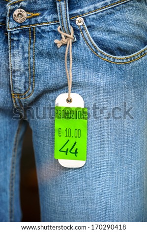 MILAN, ITALY - SEPTEMBER 26: a blue jeans special offer is display on a fashion shop of Milan, Italy. September, 26 2008.