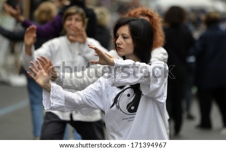 MILAN, ITALY - OCTOBER 14: Outdoor Tai Chi lesson group in the street of Milan October, 14, 2012.