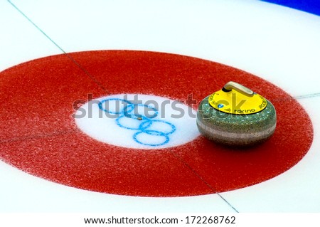 TURIN, ITALY - MARCH 28: Curling stone in the red target during a Curling match of the Winter Olympic Games in Turin, March 28, 2006.