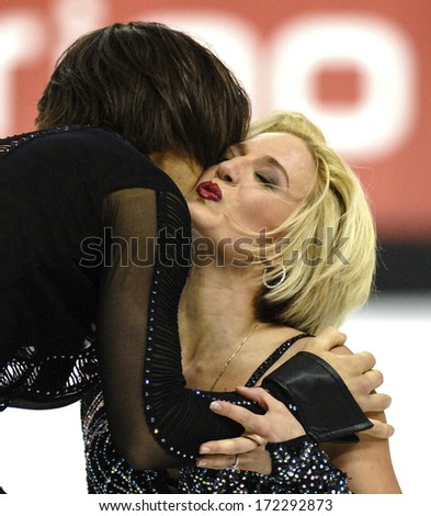 TURIN, ITALY - MARCH 28: Couple kissing after perform during Figure Ice Skating competition of the  Winter Olympic Games in Turin, March 28, 2006.