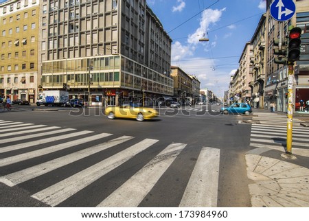 MILAN, ITALY - FEBRUARY 24: Pedestrian crosswalk with few cars on the streets in downtown Milan February 24, 2005