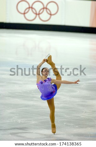 TURIN, ITALY - FEBRUARY 24, 2006: An athelete performs during the Winter Olympics female\'s final of the Figure Ice Skating.