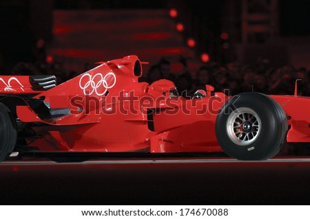 TURIN, ITALY-FEBRUARY 11, 2006: Ferrari Formula One car enters on stage during the Opening ceremony of the Winter Olympic Games of Turin 2006.