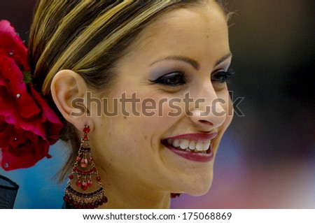 TURIN, ITALY-FEBRUARY 21, 2006: Tanith Belbin during the medals ceremony  on the Couple Figure Ice Skating\'s final during the Winter Olympic Games of Turin 2006.