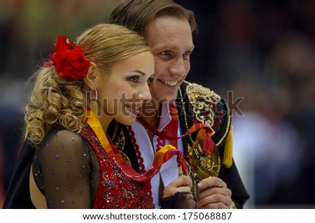 TURIN, ITALY-FEBRUARY 21, 2006: Tatiana Navka and Roman Kostomarov with the golden medals won on the Couple Figure Ice Skating\'s final during the Winter Olympic Games of Turin 2006.
