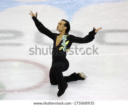 TURIN, ITALY-FEBRUARY 20, 2006: Maurizio Margaglio on his knees at the end of the Couple Figure Ice Skating\'s final during the Winter Olympic Games of Turin 2006.
