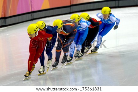 TURIN, ITALY FEBRUARY 19, 2006: Athletes group during the Short Track competition at the Winter Olympic Games of Turin 2006.