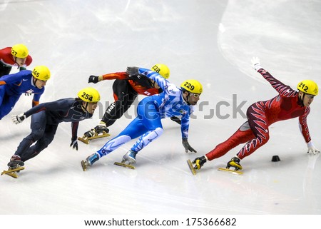 TURIN, ITALY FEBRUARY 08, 2006: Athletes group during the Short Track competition at the Winter Olympic Games of Turin 2006.