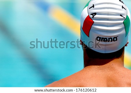 ROME, ITALY-JUNE 14, 2006: Professional swimmer man back view looks on during the  International Swimming Race \