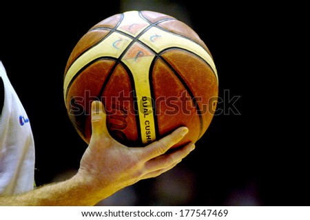 MILAN, ITALY-NOVEMBER 15, 2006: Referee holding a basket ball during a professional match of the Italian Basketball League.