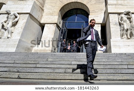 MILAN, ITALY-SEPTEMBER 13, 2012: Businessman gets down the Stock Exchange building\'s stair, in Milan.