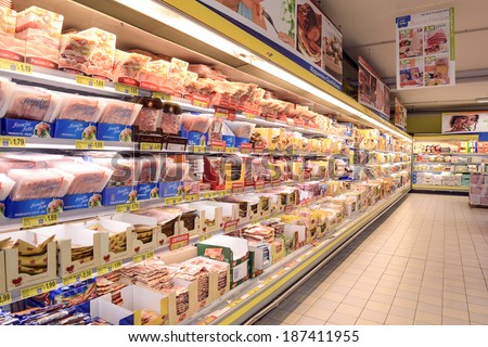 VARESE, ITALY-APRIL  11, 2014: Packaged food in a supermarket refrigeratore shelve, in Varese.