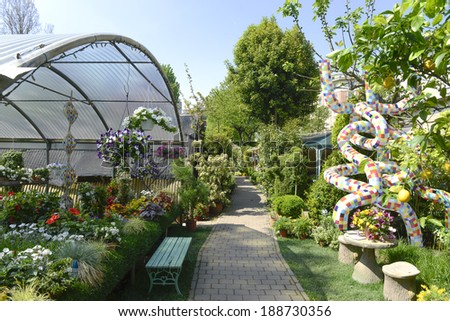MILAN, ITALY-APRIL 09, 2014: design art installation of the German design artist, Markus Benesch, with variety of flowers on display in the garden shop, Vivaio Riva, in Milan.