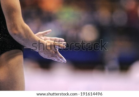 MILAN, ITALY-APRIL 02, 2009: close up of gymnast hands with white magnesium, during the European Artistic Gymnastic Championship, in Milan.