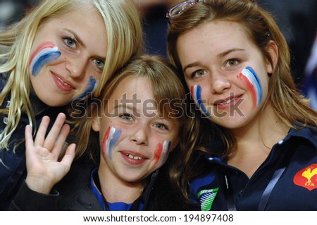 PARIS, FRANCE-OCTOBER 20, 2007: french supporters girls, with masked face,during the semi-final Argentina vs France, of the Rugby World Cup, France 2007, in Paris.