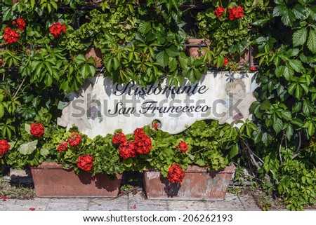 ASSISI, ITALY-JULY 03, 2014: restaurant sign dedicated to saint francis, in Assisi.