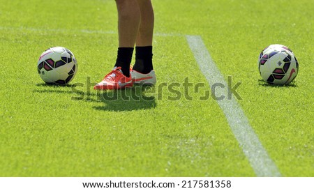 MILAN, ITALY-SEPTEMBER 14, 2014: soccer player training with a ball on the soccer pitch of San Siro stadium, before the Serie A professional soccer match Inter vs Sassuolo, in Milan.