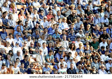 MILAN, ITALY-SEPTEMBER 14, 2014: soccer fans at San Siro stadium watching the Serie A professional soccer match Inter vs Sassuolo, in Milan.