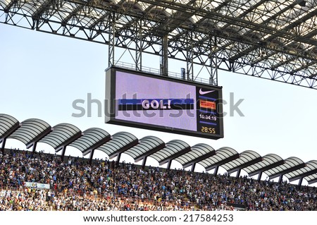 MILAN, ITALY-SEPTEMBER 14, 2014: electronic score board with soccer fans at San Siro stadium watching the Serie A professional soccer match Inter vs Sassuolo, in Milan.
