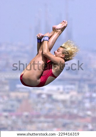 BARCELONA, SPAIN-JULY 14, 2003: italian Tania Cagnotto in action during the final of the Swimming World Championship, with the Gaudi cathedral in the back, in Barcelona.