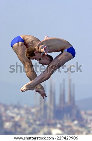 BARCELONA, SPAIN-JULY 12, 2003: male synchronized divers in action during the final of the Swimming World Championship, in Barcelona.