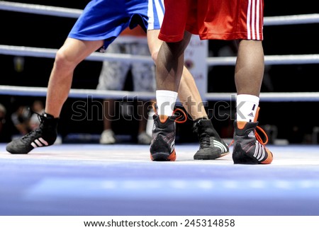 MILAN, ITALY-SEPTEMBER 07, 2009: close up legs of non professional boxe match leon alarcon vs andreiani of the boxe amateur world championship, in Milan