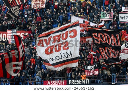MILAN, ITALY-JANUARY 18, 2015: AC Milan soccer fans waving flags to support their team at the san siro stadium, during the italian serie A soccer match AC Milan vs Atalanta, in Milan.