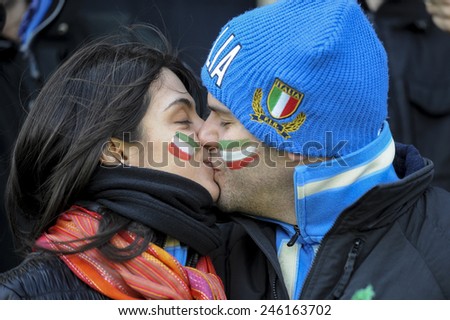 ROME, ITALY-MARCH 20, 2008: italian rugby fans couple kissing at the Flaminio stadium before the start of the rugby Six Nations match, Italy vs France, in Rome