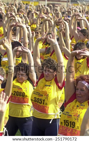 MILAN, ITALY-MAY 18,2003: women fitness exercising before the female non competitive running race Avon Running, in Milan.