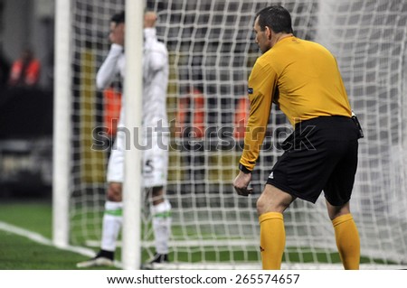 MILAN, ITALY- MARCH 19, 2015: assistant referee next by the goalpost line during the UEFA Europa League match FC Internazionale vs Wolfsburg, at the San Siro stadium, in Milan