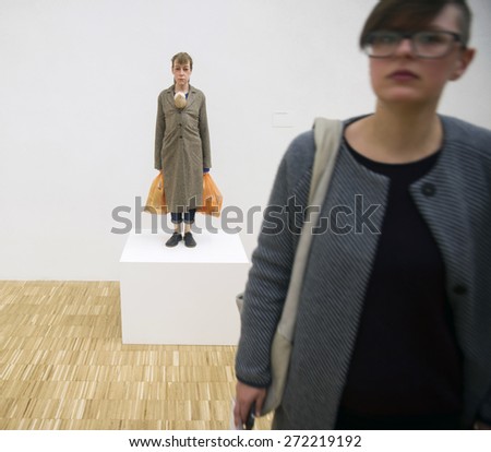 MILAN, ITALY-APRIL 17, 2015: modern art sculpture, woman with shopping bags, exposed during the Arts and Foods exhibition at the architecture, design and arts museum La Triennale, in Milan.