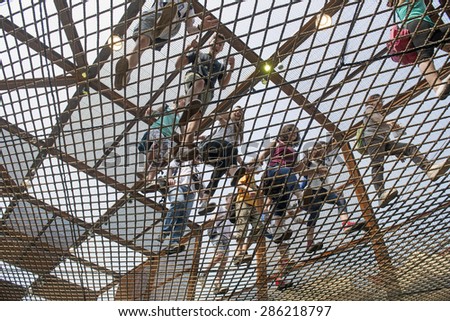 MILAN, ITALY-JUNE 05, 2015: visitors walking on the Brazil pavillion elastic rubber pavement at EXPO 2015, in Milan.
