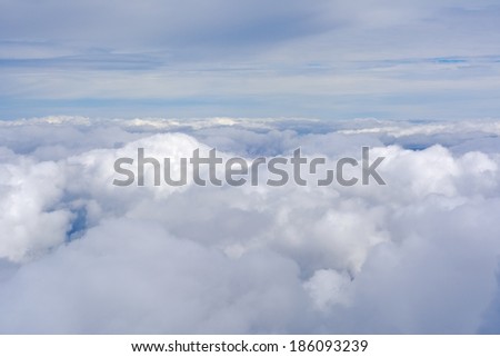 Unusual aerial view of clouds and blue skies above the earth.