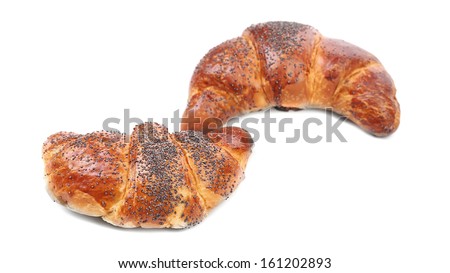 Appetizing croissants with poppy. Isolated on a white background.