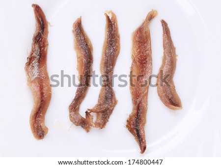 Marinated anchovies. Isolated on a white background.