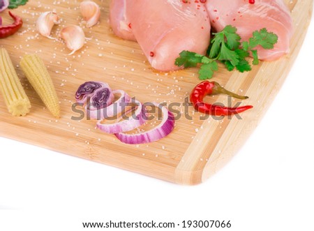 Meat composition on wooden platter. Whole background.