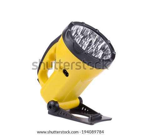 Yellow plastic pocket handle flashlight. Isolated on a white background.