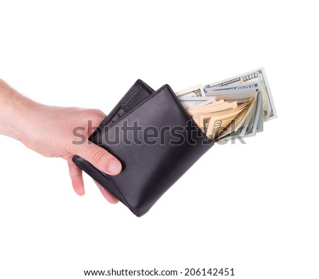 Purse in hand full with dollar bills. Isolated on a white background.